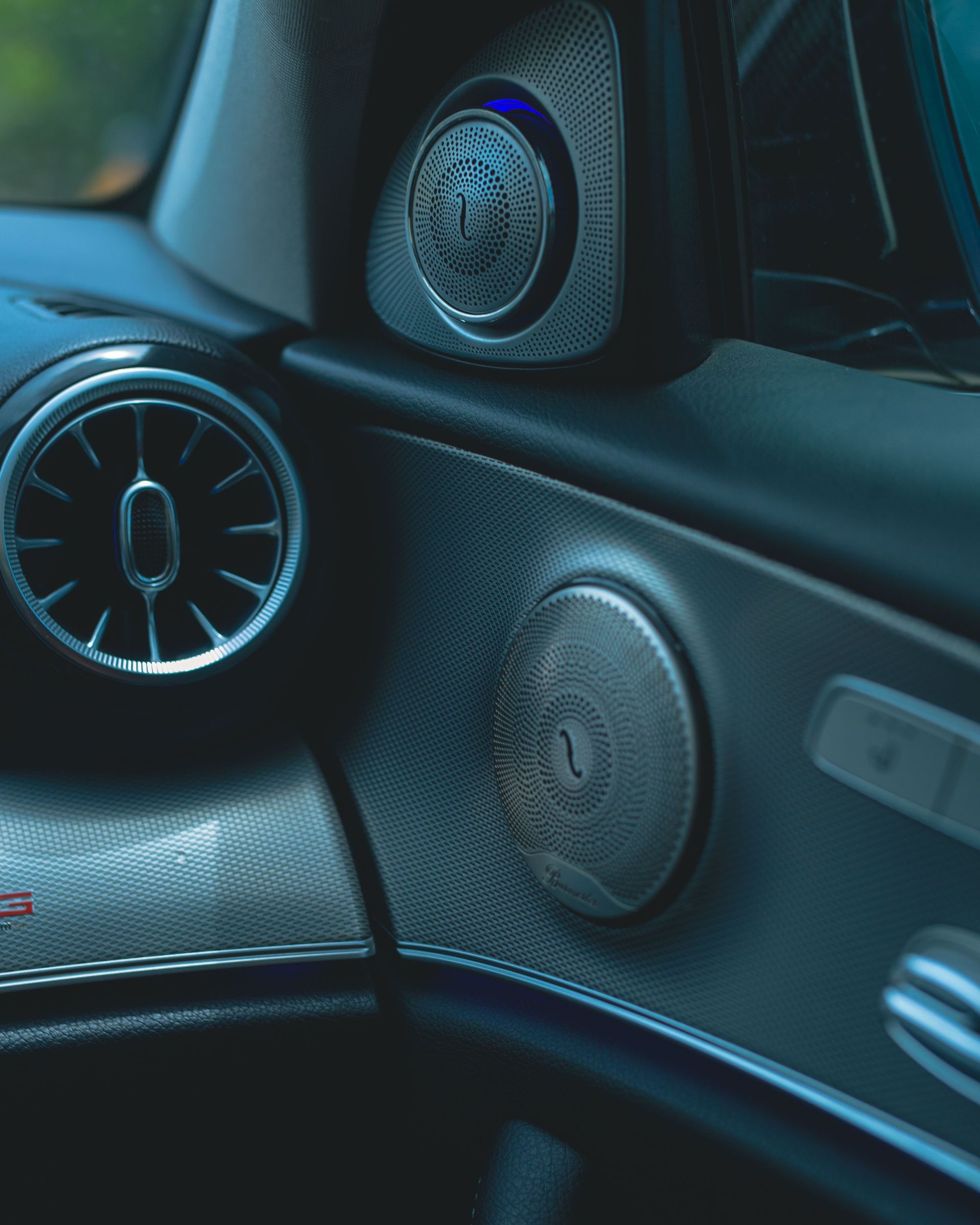 Close-up view of a luxury car dashboard, showcasing sleek design and premium materials.